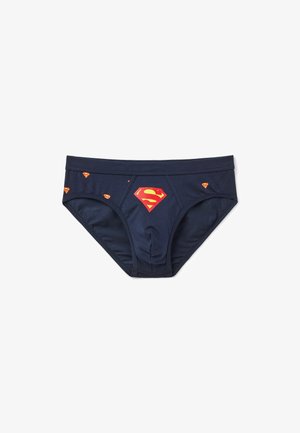 Marineblauwe katoenen boxershorts met een groot rood en geel Superman-logo aan de voorkant, en kleinere logo's verspreid over de stof.