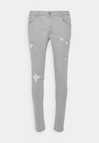 Grå denimjeans med slim fit, prydda med flera slitna lappar och ett stjärnformat rivsår. Klassisk femficksdesign med knappstängning.