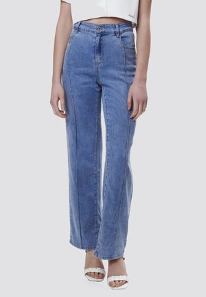 Light blue high-waisted jeans with a wide leg design, featuring front pockets and contrasted stitching. Material appears denim with a smooth texture.