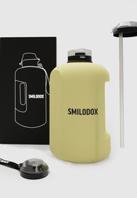 Yellow water bottle with a matte finish, featuring a black logo, a screw-on lid, and a wide mouth. Includes a black strap and straw.