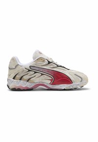 Sneakers med en beige overdel med røde og sorte accenter. Tekstureret design langs siderne, rund tå og hvide snørebånd. Gummisål.