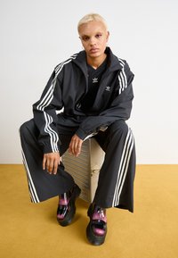 adidas Originals ZIP OFF - Treniņtērpa apakšdaļas - black