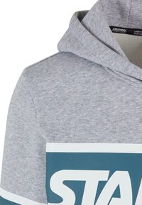 Sweat à capuche gris en tissu doux, orné d'un grand motif teal avec le mot "STARTER" sur la poitrine et d'un cordon de serrage.
