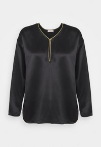 Haut noir en satin à manches longues avec un col en V et un détail de fermeture éclair dorée contrastante. Présente une coupe décontractée et une texture lisse.