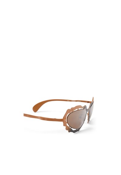Brown metal sunglasses with a delicate scalloped frame, tinted lenses, and slim arms. The design features intricate detailing on the edges.