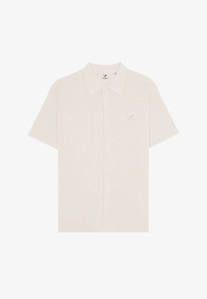 Short-sleeve cream knit polo shirt with textured pattern, button front, and small embroidered logo on left chest.