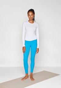 Athleta SALUTATION STASH 7/8 - Leggings - caribana blue