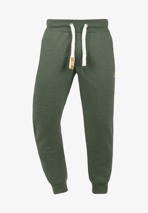 Grüne Sweatpants aus Baumwollmischgewebe. Mit elastischem Bund und weißen Kordeln sowie gerippten Bündchen. Dezente Logodetails.