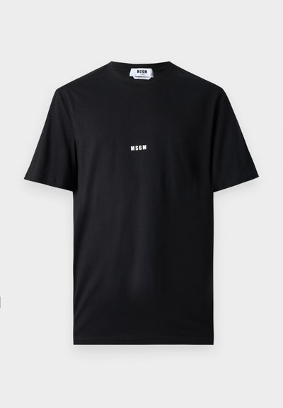 Black cotton t-shirt featuring a crew neck and short sleeves. Front displays white "MSGM" logo centered. Smooth texture, standard fit.