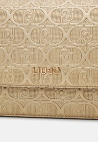LIU JO CROSSBODY - Olkalaukku - gold-coloured