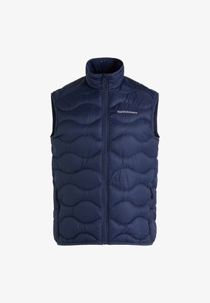 Marineblauwe geïsoleerde mouwloze vest met een gewatteerd golfpatroon, hoge kraag en een ritssluiting aan de voorkant. Voorzien van zijzakken met ritsen.