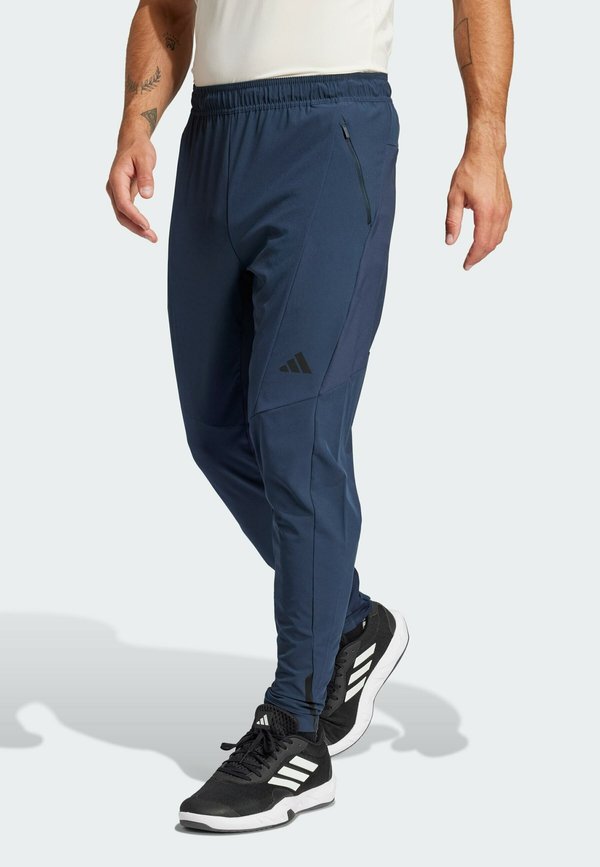 DESIGNED FOR HYBRID - Tracksuit bottoms - aurora ink