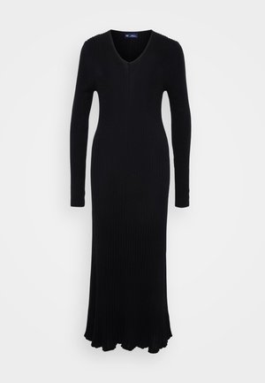 Schwarzes Rippstrickkleid mit langen Ärmeln, V-Ausschnitt und ausgestelltem Saum. Hergestellt aus einem dehnbaren Material für eine figurbetonte Silhouette.