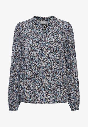 Zieds drukas blūze ar tumši zilām fonu un ziliem, zaļiem un baltiem rakstiem. Garas piedurknes ar elastīgiem aprocēm un brīvu piegriezumu.