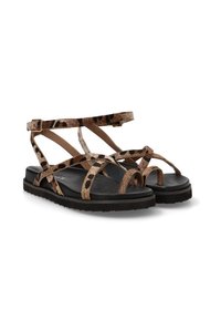 Sandalias con estampado de leopardo marrón, con múltiples correas, plantilla negra y suela gruesa. Cuentan con una correa ajustable en el tobillo para un ajuste seguro.
