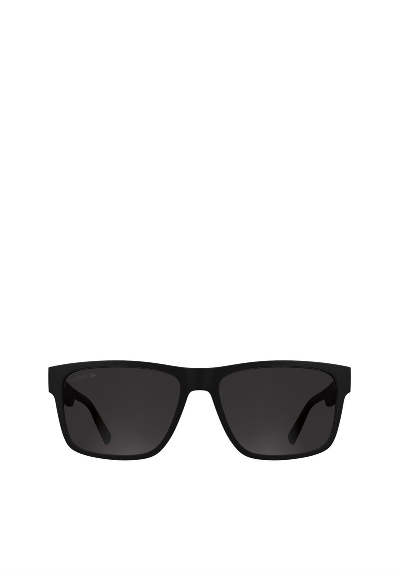 Lunettes de soleil rectangulaires noires avec verres foncés, fabriquées en plastique lisse. Présentent un design minimaliste et un branding subtil sur la branche.