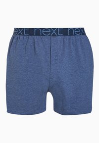 Boxeri din bumbac albastru cu un mijloc elastic, având cuvântul "next" într-o culoare contrastantă, cu un sistem de închidere cu un singur buton și un design simplu.
