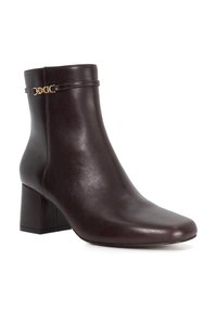 Brown leather ankle boot with a square block heel. Features a gold chain accent around the ankle and a smooth, glossy finish.