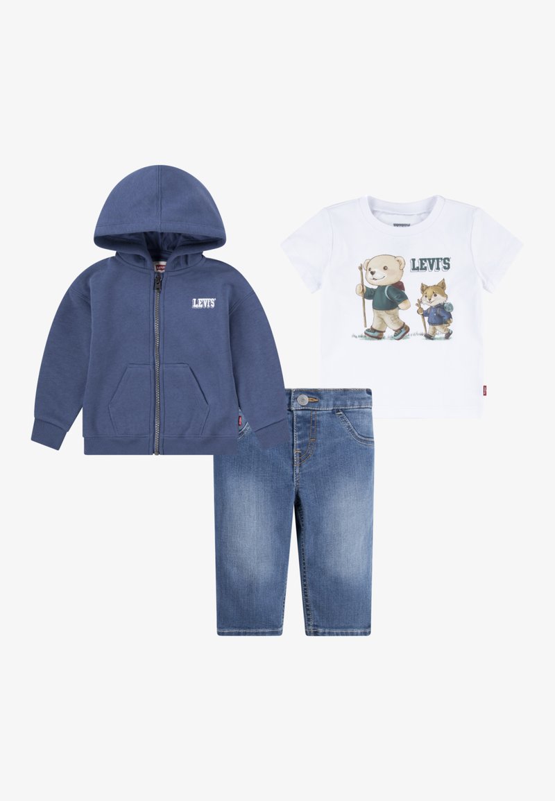 Mornarska zip-up kapuca, bela majica s grafiko živali in svetlo modri traper kratki hlače. Bombažni material, sproščen kroj, žep na kapuci.