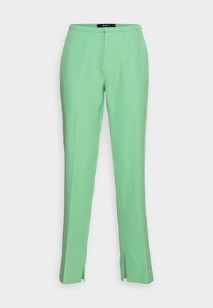 Green trousers made of smooth fabric, featuring a straight leg and side slits at the hem. The design has a clean finish and subtle stitching.
