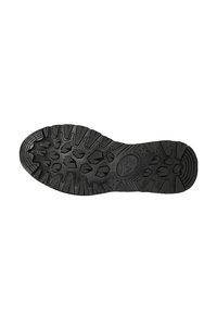 Black rubber shoe sole featuring an intricate tread pattern with hexagonal and angular designs for improved traction and grip.