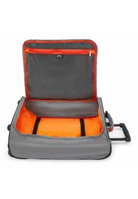 Gray wheeled suitcase with an orange interior, featuring a mesh zip pocket and securing straps. The exterior has a smooth texture and black accents.