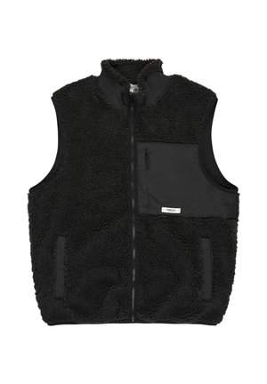 Mustavilla fleece-työtakki, jossa on korkea kaulus, vetoketjulla suljettu ja läpällinen tasku. Takki on pehmeä ja siinä on sileä paneeli rinnassa.