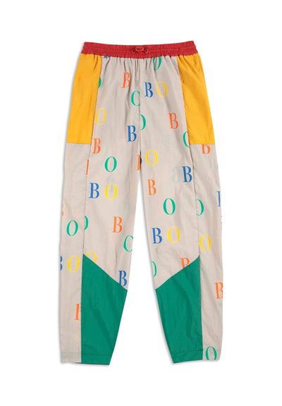 Kleurvolle, gestreepte broek van lichtgewicht stof. Bevat een elastische tailleband, meerkleurige secties in geel, groen en rood, met letters.