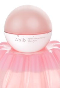 Masque pour les lèvres au collagène PDRN par Abib, doté d'un couvercle rond et translucide en rose pâle sur une base texturée semblable à de la gelée, avec un dégradé de tons roses.