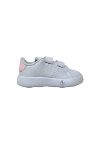 White sneaker with pink accent, made of synthetic material. Features hook-and-loop straps and perforated design on the sides. Rounded sole.
