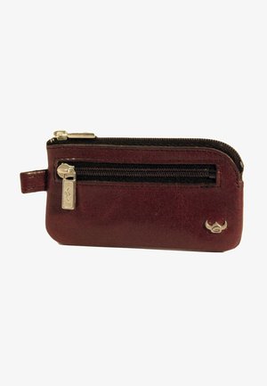 Portefeuille en cuir marron avec fermeture zippée, design mince, accents en matériel argenté et petit logo sur le côté.