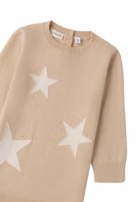 Maglione beige lavorato a maglia con tre stelle bianche e accenti scintillanti. Ha un collo rotondo e maniche a tre quarti. Texture morbida.