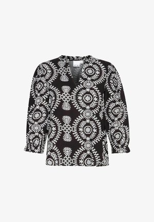 Blouse noire avec broderie florale blanche, présentant un décolleté en V, des manches bouffantes trois-quarts et une coupe ample. Tissu texturé avec un design à motifs.