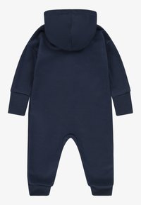 Navy blue, soft cotton onesie with long sleeves and a hood. Features a round neckline and elastic cuffs, designed for comfort and ease.