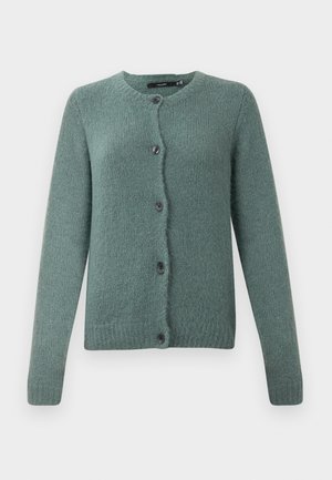 Grønn strikket cardigan med rund hals, knapping og lange ermer. Har teksturert stoff og mørke knapper.