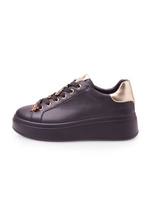 Black low-top sneakers with a shiny finish, gold accents, and a thick platform sole. Features gold eyelets and a decorative charm.