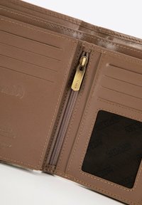 Brown leather wallet interior featuring multiple card slots, a zippered coin pocket, and a transparent ID slot. Gold zipper pull accent.