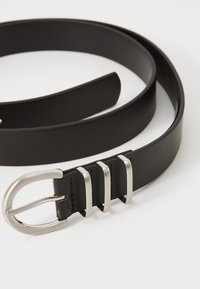 Black leather belt with a smooth texture, featuring a silver metal buckle and three rectangular keepers.