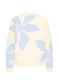 Vaalean kermainen neulepaita, jossa on suuri kukkakuvio vaaleansinisenä. Kuvio peittää selän ja hihat, ja paidassa on pyöreä pääntie sekä resorit hihansuissa.