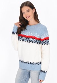 Kraftig stickad tröja i kräm, ljusblå och röd, med ett geometriskt mönster, rund halsringning och ribbade mudd och fåll.