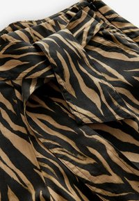 WIDE - Pantaloni - animal