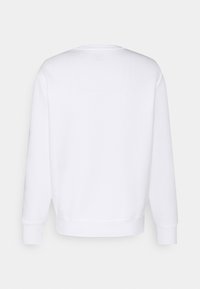 Vue de dos d'un sweat-shirt blanc uni à manches longues avec poignets et ourlet côtelés sur un fond neutre.