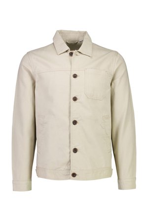 Veste beige en coton avec une fermeture à boutons, poche poitrine et deux poches latérales ; dotée de boutons marron et d'un col.