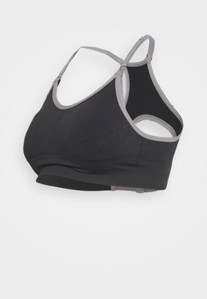 Sutien desportivo preto com detalhes em cinza, apresentando uma textura suave, alças largas e um design racerback para suporte. Fecho ajustável com gancho nas costas.