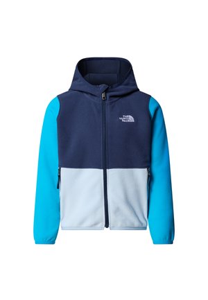 Jopica z nizom s kapuco v barvnem bloku modre, svetlomodne in mornarsko modre barve. Zapiranje z zadrgo, dva stranska žepa in mehka tekstura.