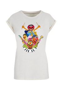 White short-sleeve t-shirt featuring a colorful graphic of six cartoon characters playing musical instruments against a light background.