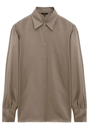 Chemise beige à manches longues avec boutons, col large et poignets ajustés, présentée à plat sur fond blanc.