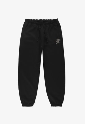 Czarne dresy wykonane z miękkiego materiału, z elastycznym paskiem w talii, sznurkiem do regulacji, bocznymi kieszeniami oraz subtelnym logo na lewej udzie.