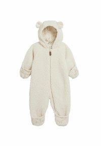 Creme fleece heldragt med hætte, der har bjørneører, frontlynlås og tekstureret overdels. Kanten har et subtilt dyreprint mønster.