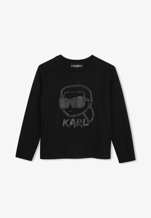 Zwarte lange mouwen shirt met een getextureerde afbeelding van een gezicht met een zonnebril en het woord "KARL" eronder in het midden aan de voorkant.